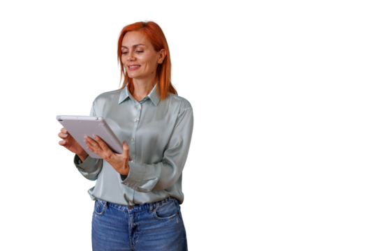 Redhead woman using a digital tablet for business communication, smiling, standing on a transparent background
