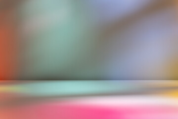 Abstract pastel colorful blur light on wall and table. Stained glass light.