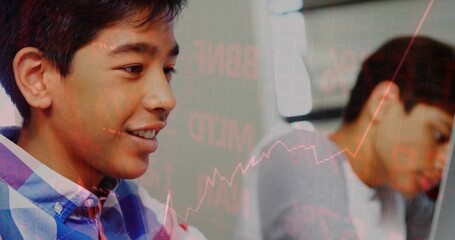 Two teenage boys wearing checkered shirt and grey tee studying in study space, stock chart overlay