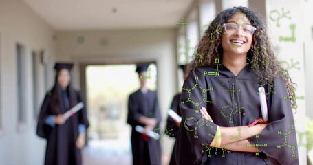 Smiling Asian student holding diploma in school corridor with green chemical overlays, copy space