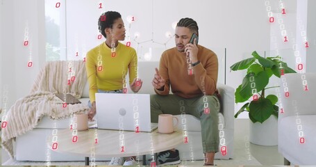 Collaborating coworkers discussing project in modern living room, with laptop smartphone and mugs