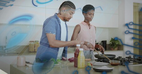 Chopping vegetables on cutting board and stirring frying pan in bright kitchen, digital overlay