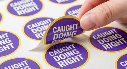 Hand Peeling "Caught Doing Right" Sticker from Sheet