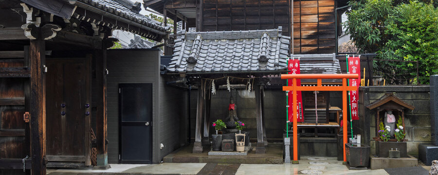 Scenic view of a temple in Yanaka subsurb in Tokyo, Japan. Yanaka is an atmospheric, traditional part of Tokyo known for its nostalgic atmosphere, temples and cats.