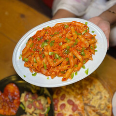 Delicious homemade pasta dish with rich tomato sauce and fresh green herbs a vibrant and appetizing meal for any occasion