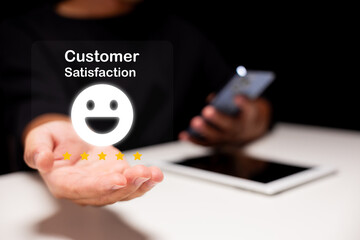 A person holds their hand out displaying a smiling emoji, symbolizing customer satisfaction and feedback in a digital context.