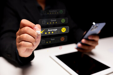 A person interacts with a digital feedback interface on a smartphone, selecting a rating, signifying customer experience evaluation.