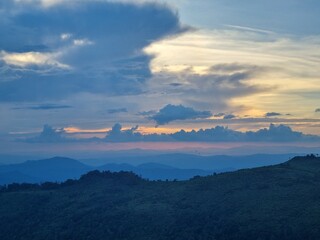 Mountain Silhouette at Sunset: An awe-inspiring image that captures the mesmerizing beauty of a mountain range silhouetted against a sky ablaze with the colors of sunset.