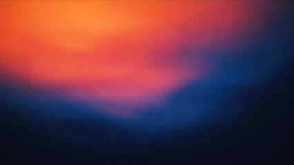 Fototapeta premium Soft abstract gradient of orange and deep blue colors with a hazy texture 
