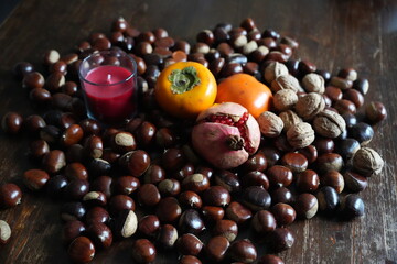 Autumn colors and flavors: chestnuts, walnuts, pomegranates, and persimmons