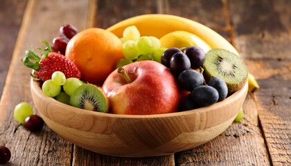 assorted fruits in bowl on wooden surface