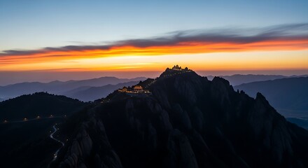 Mountain Temple Complex Illuminated at Twilight with Dramatic Sunset Sky architecture traditional