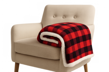Red and black buffalo check plaid blanket, rolled and draped over a cream-colored armchair, presenting a cozy home textile