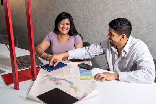 Colleagues collaborating on a project in a modern office
