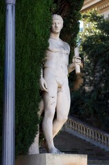 A naked man sculpture statue in a park in Barcelona, Spain