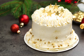 Delicious cake with Christmas decor on grey table, closeup