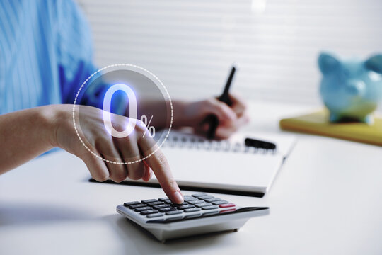 Woman with paperwork using calculator at table, closeup. 0 percent representing zero commission
