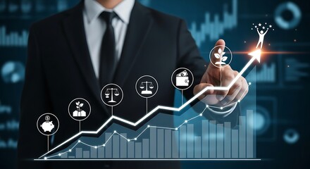 Businessman pointing at upward trending graph with financial icons