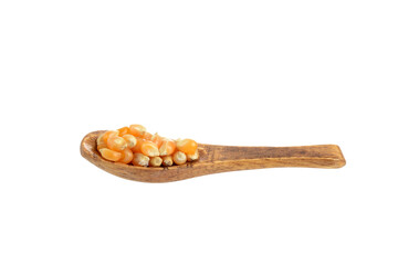 isolated wooden spoon of popcorn kernel seeds