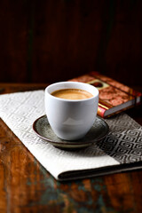 Cup of coffee on rustic wooden background. Soft focus. Copy space	