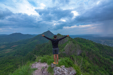 a man on top of mountain