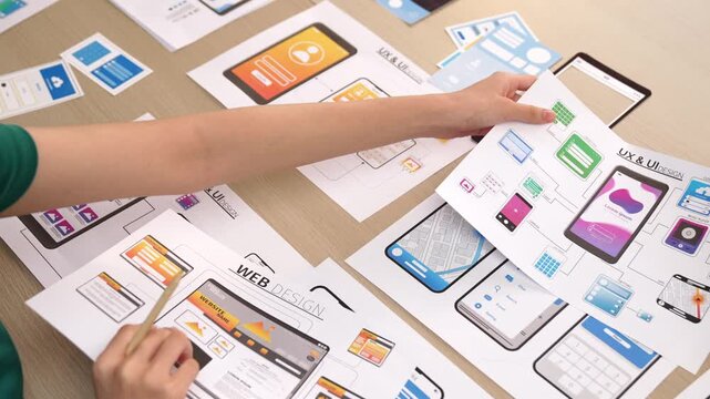 Panorama video of startup company employee planning on user interface prototype for mobile application or website in office. UX UI designer brainstorm designing user friendly interface plan. Synergic