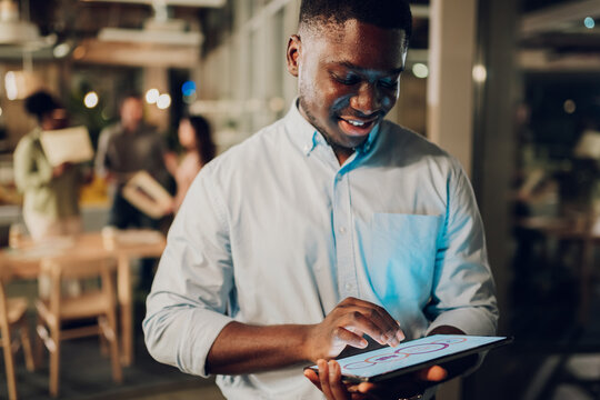African american man using tablet in office