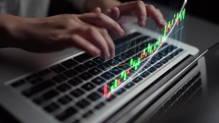 A close-up of hands typing on a laptop keyboard, showcasing an overlay of financial charts to illustrate stock market trends and data insights in a modern workspace. Copula - Powered by Adobe