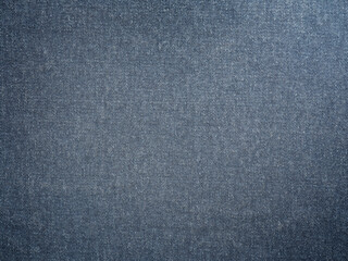 Blue jeans denim fabric texture background with diagonal weawing. Closeup, macro jeans background. Design element.