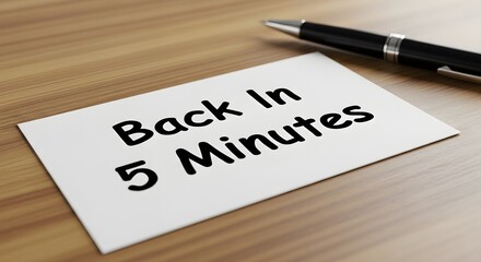 Back In 5 Minutes" Announcement A Quick Break with Pen Beside Notice Sign
