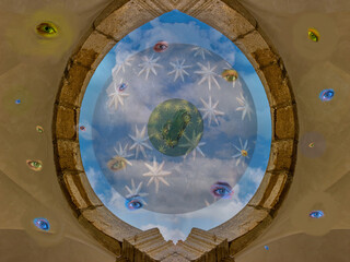 DREAM N°120 – The Eye of the Cosmos. Surreal and conceptual artwork representing a cosmic dome filled with floating eyes, stars, and clouds within a circular architectural structure.