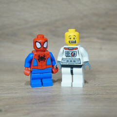 Naklejka premium Lego Spider-Man and Astronaut Minifigures Standing Together