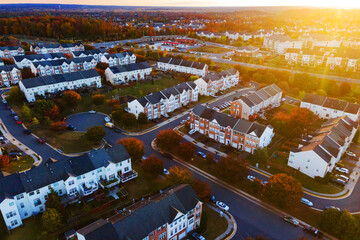 Sunrise over colorful fall housing development in Leesburg, Virginia.