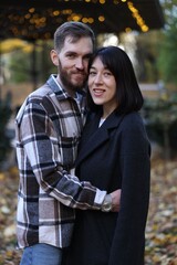 Fototapeta premium Happy couple hugging in autumn park. Romantic relationship