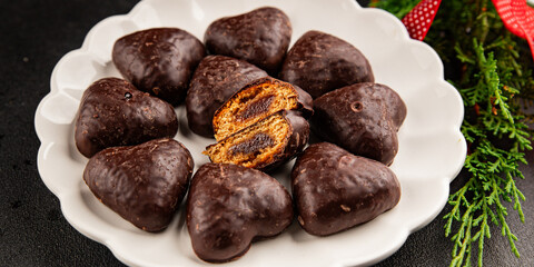 Gingerbread chocolate heart shaped honey cakes Christmas sweet dessert new year natural product tasty snack fresh delicious gourmet food background on the table rustic top view copy space