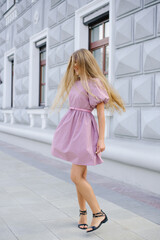 Stylish Woman With Long Hair In Urban Setting