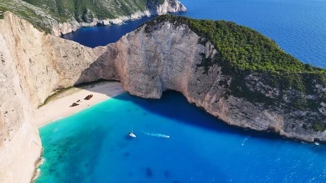 Aerial drone cinematic video of one of the most photographed beaches in the world called navagio or shipwreck a ship rest to rust ashore vanishing through the years, Zakinthos island, Ionian, Greece