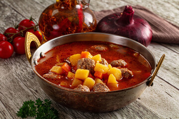 Tomato soup with meatballs and vegetables