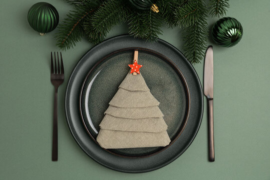 Christmas Table Setting with Napkin Tree, Red Star, and Green Ornaments