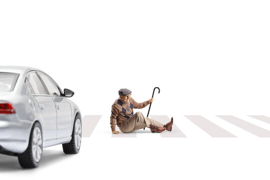 Elderly man hit by a car sitting on a zabra crossing