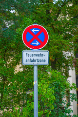 No parking traffic sign with the text Feuerwehranfahrtzone &mdash; fire access zone.