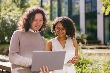 team inspects outside, study group reviews design features under open sky conditions during daylight