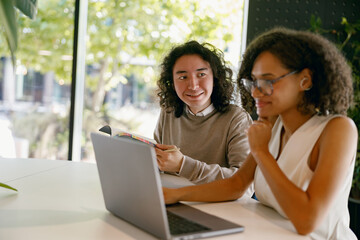 mentor provides personalized coaching to colleague amid engaging digital instructional environment