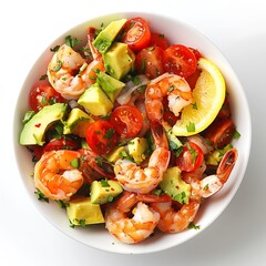 Aerial view of a bowl filled with shrimp avocado tomato and lemon salad mixture dish