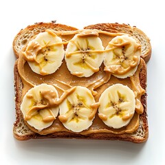 A slice of toast topped with peanut butter and sliced bananas drizzled with more peanut butter