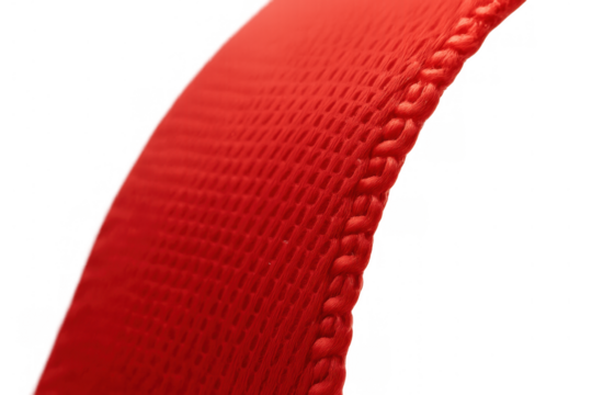 Close up of red woven textile strap with textured surface and visible threads, featuring a braided edge on transparent background