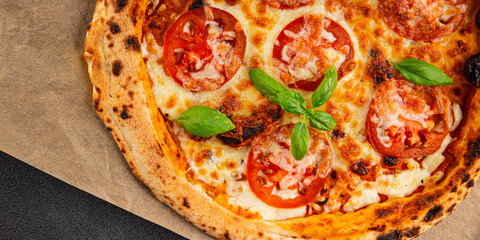 Pizza tomato margarita fast food natural product tasty snack fresh delicious gourmet food background on the table rustic top view copy space