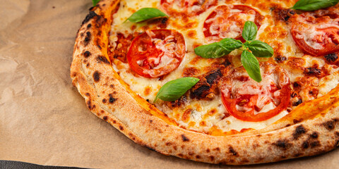 Pizza tomato margarita fast food natural product tasty snack fresh delicious gourmet food background on the table rustic top view copy space