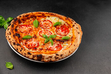 Pizza tomato margarita fast food natural product tasty snack fresh delicious gourmet food background on the table rustic top view copy space