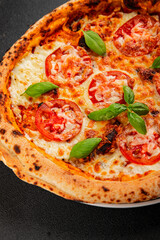 Pizza tomato margarita fast food natural product tasty snack fresh delicious gourmet food background on the table rustic top view copy space